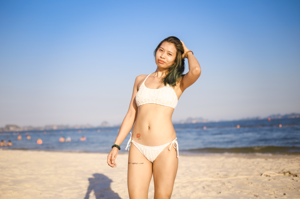 Woman in a bikini by the water