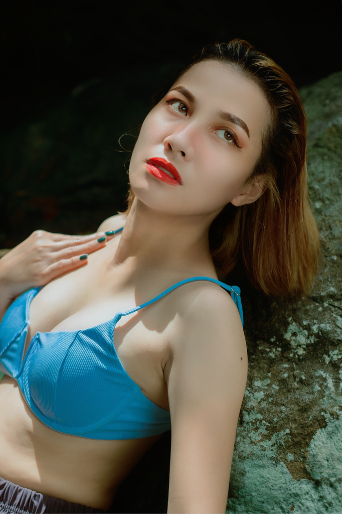 Woman in a bikini by the water
