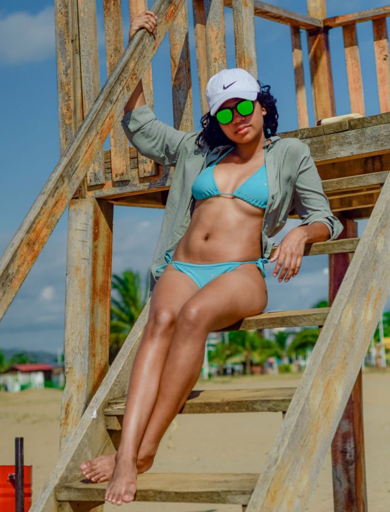 Woman in a bikini by the water